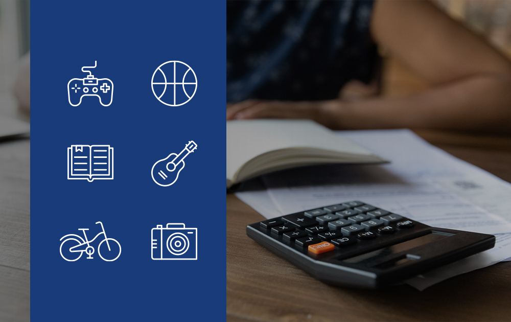 A blue panel with various hobby relted icons next to a person sitting at a desk with a book, papers, and a calculator.