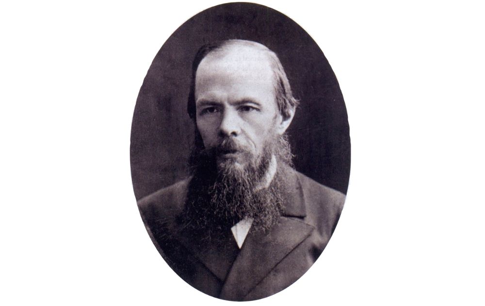 A black and white oval portrait of 19th-century author Fyodor Dostoevsky.