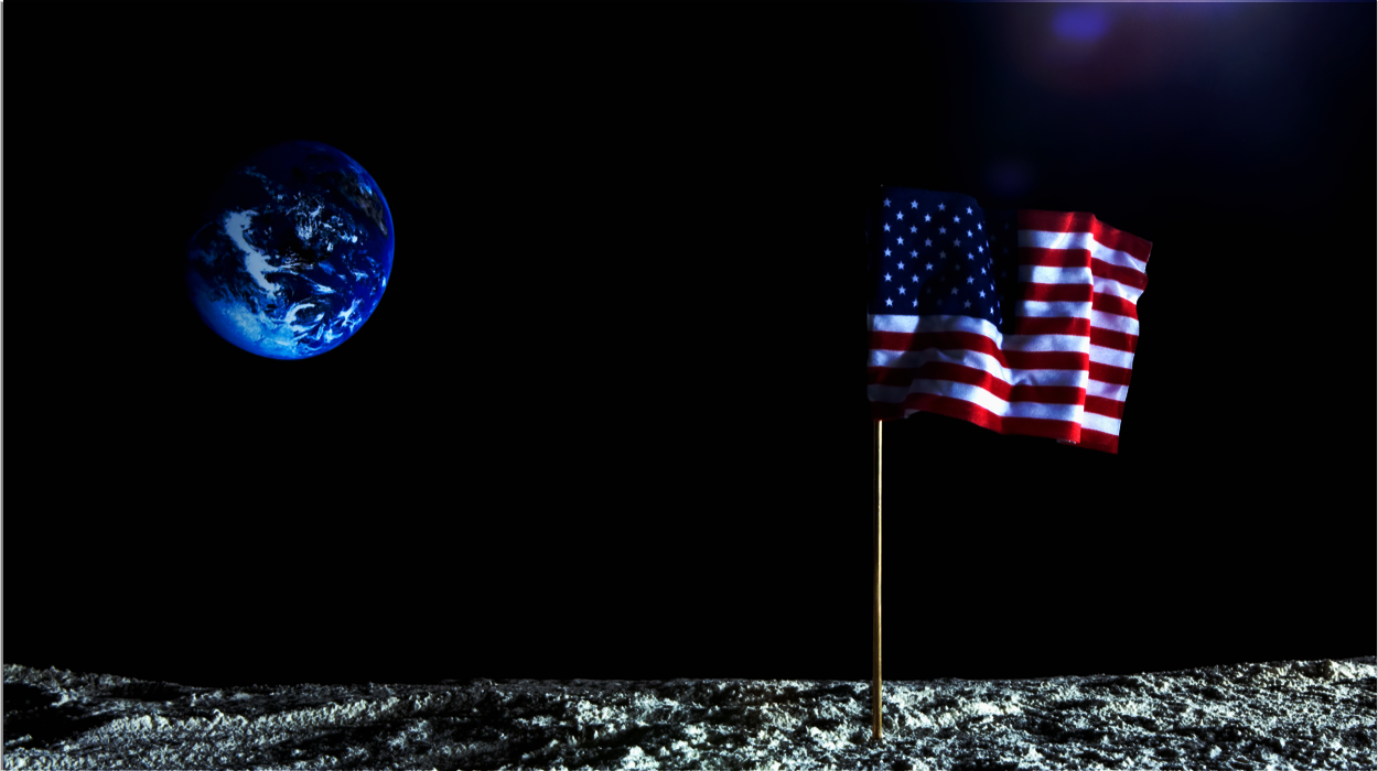 american flag on mood with earth in distance
